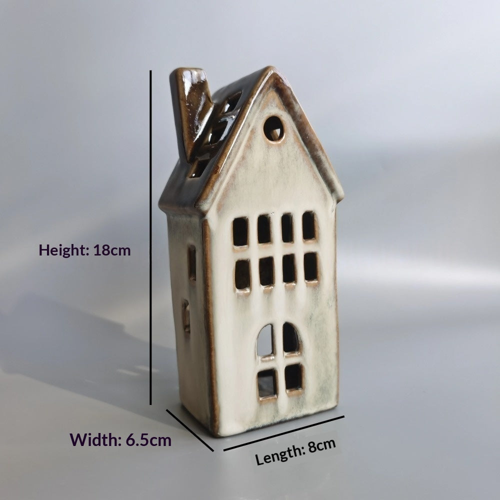 Tall glazed ceramic Christmas house tealight holder, about 18 cm